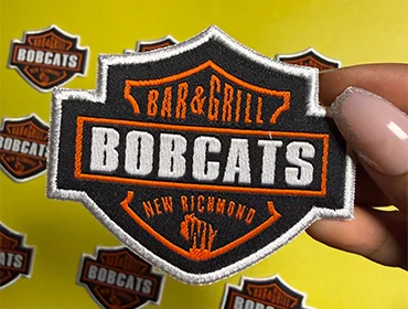 Custom embroidery of bobcats